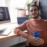 handsome programmer in headphones listening to mus 2023 11 27 04 56 48 utc.jpg