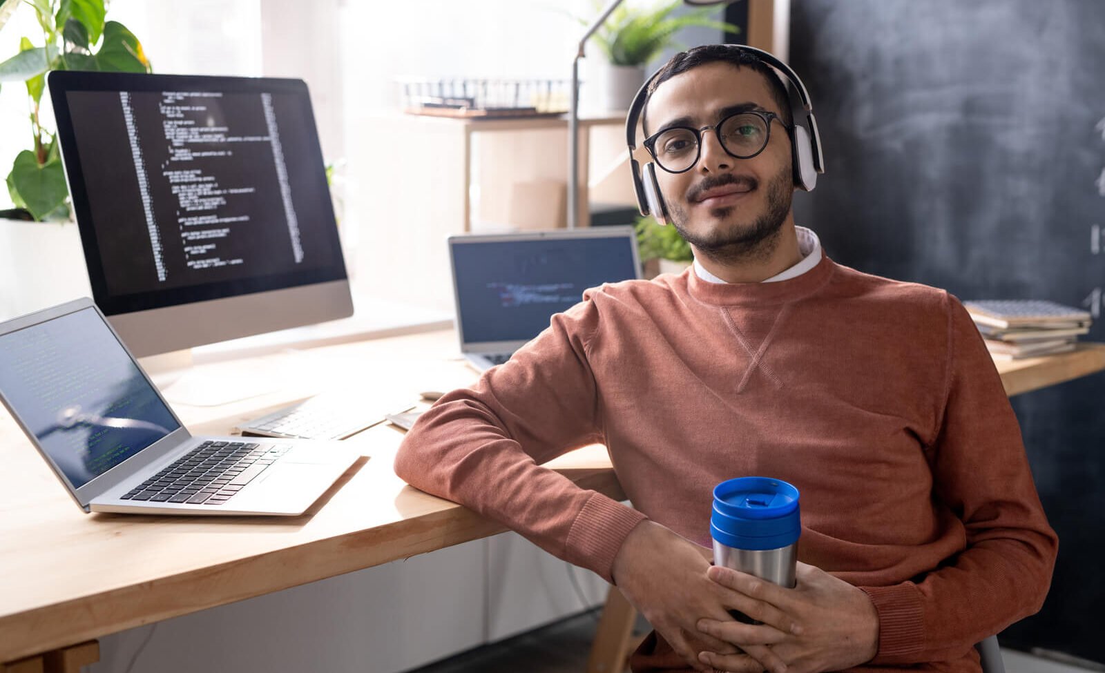 handsome programmer in headphones listening to mus 2023 11 27 04 56 48 utc.jpg